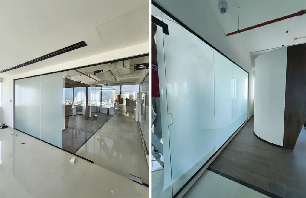 Switchable privacy glass partition in an office meeting room installed by Keystone