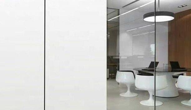Smartglass window film installed in a modern office for privacy and natural light control.